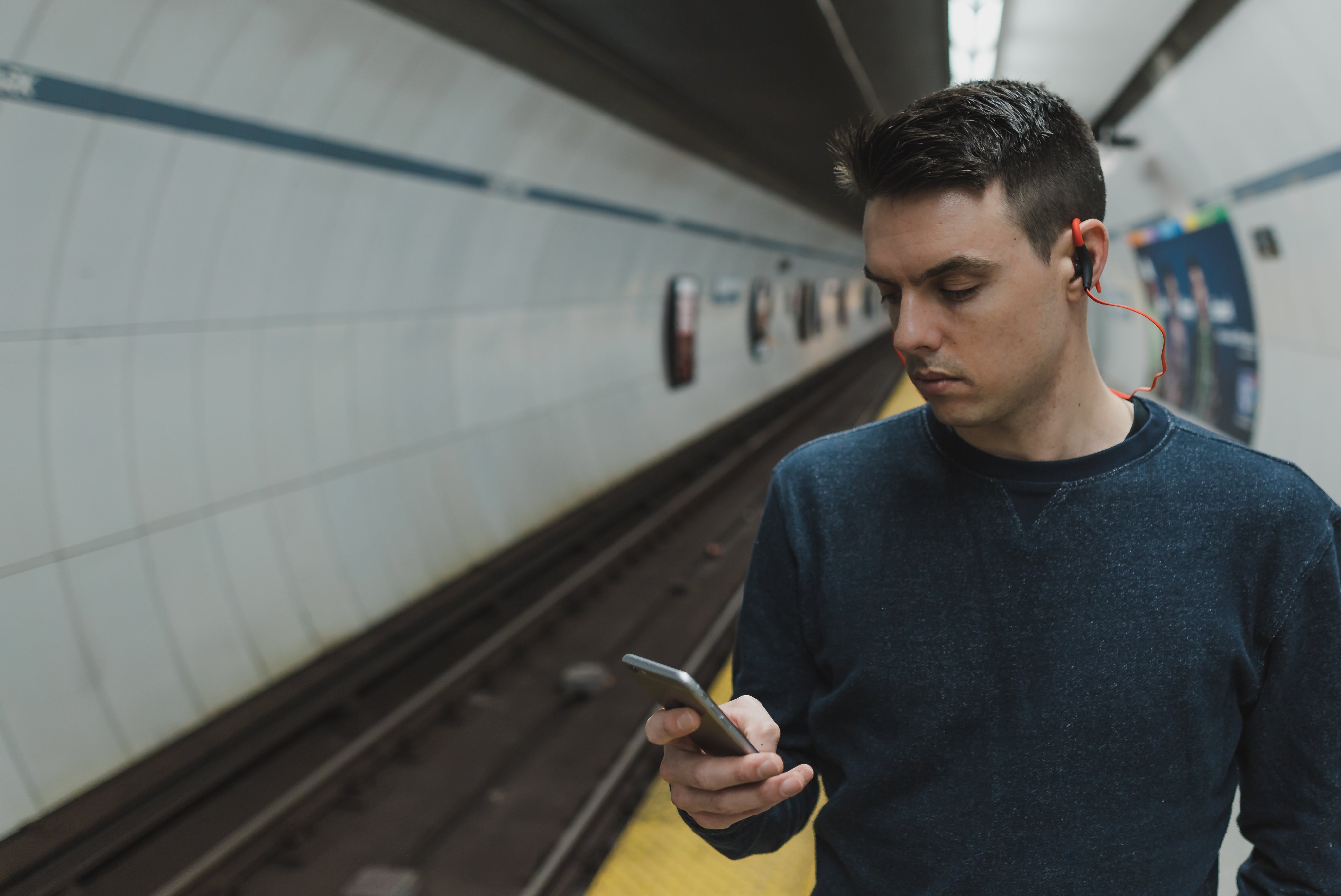 man-wearing-bluetooth-headphones.jpg